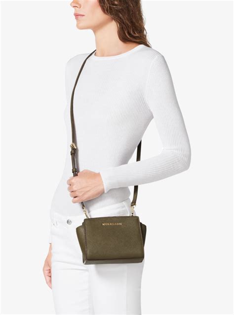 what fits in michael kors selma mini|Selma Mini Crossgrain Leather Crossbody Bag .